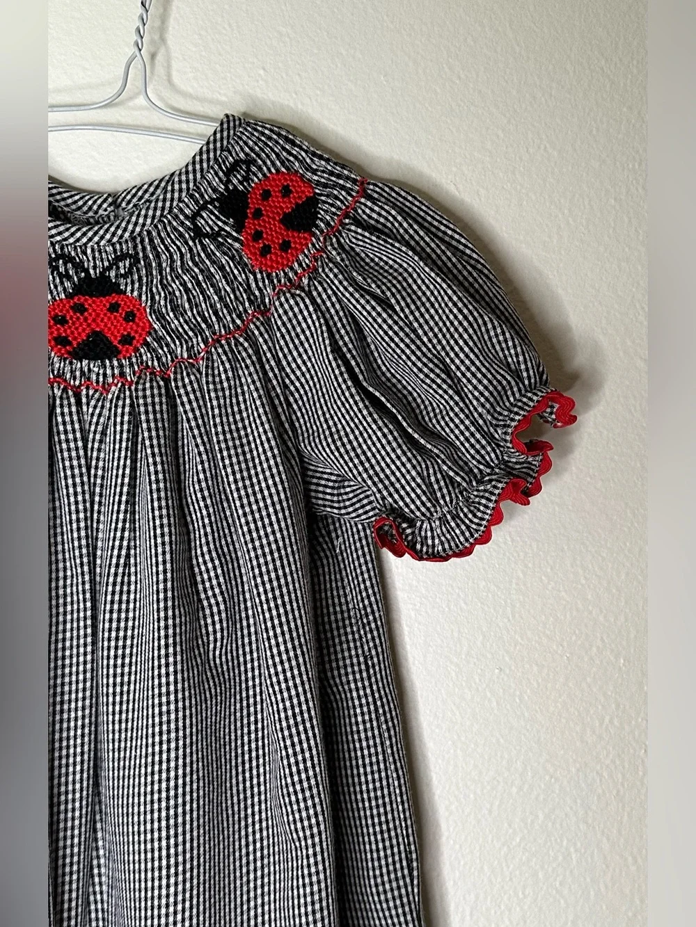 Smockadot Kids 9 month size with ladybug smocking with snap crotch .